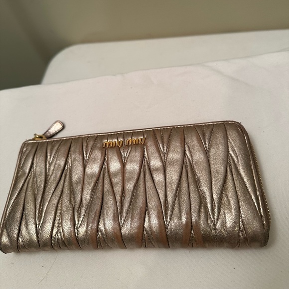 Miu Miu Accessories - MIU MIU gold leather wallet with top zipper .